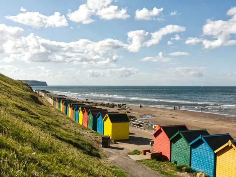 A row of painted beach huts